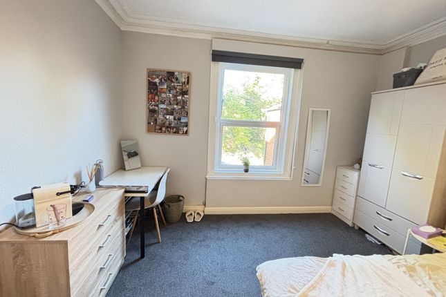 A Bright And Well-Maintained Bedroom Featuring A l...