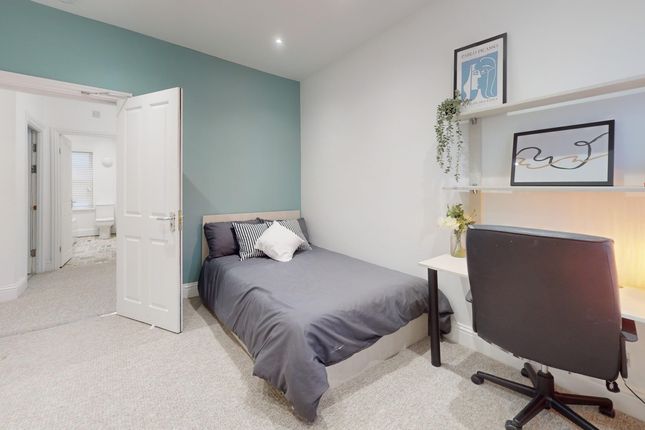 A Stylish And Well-Lit Double Bedroom Featuring A ...