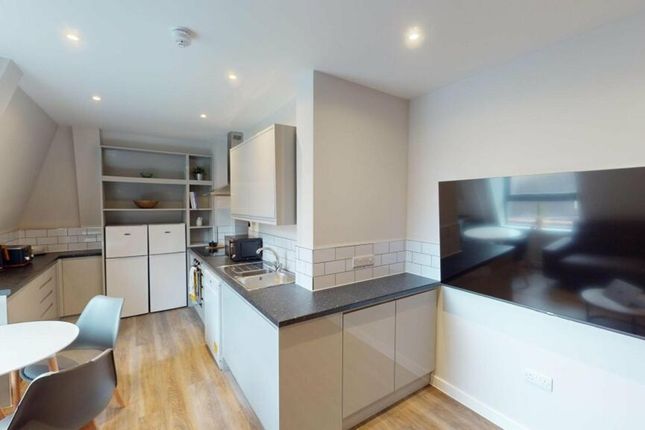 A Modern And Clean Kitchenette Featuring Sleek App...