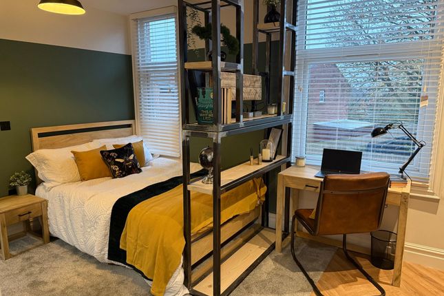 Bright And Stylish Master Bedroom Featuring A Comf...
