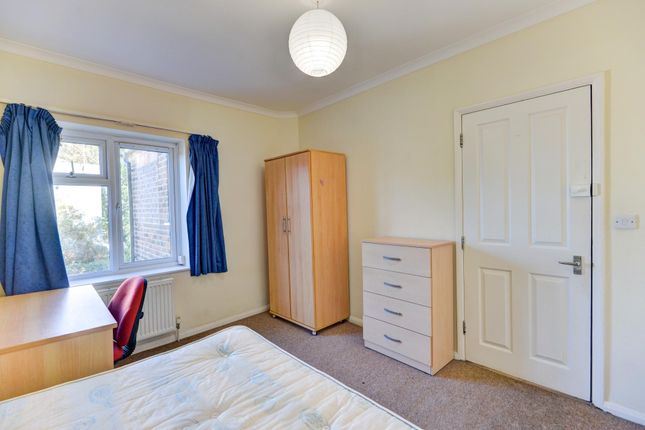 A Well-Lit Double Bedroom Featuring A Window With ...