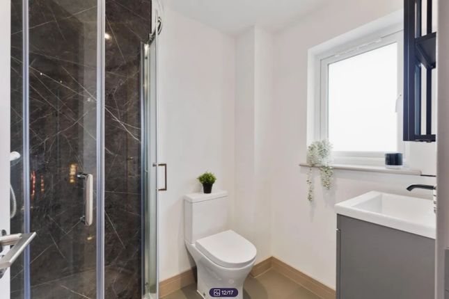 A Modern And Clean Bathroom Featuring A Stylish Sh...