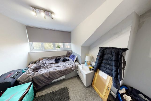 A Compact But Bright Bedroom Featuring A Single Be...