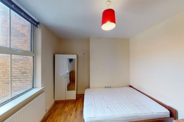 A Spacious And Well-Lit Double Bedroom Featuring l...