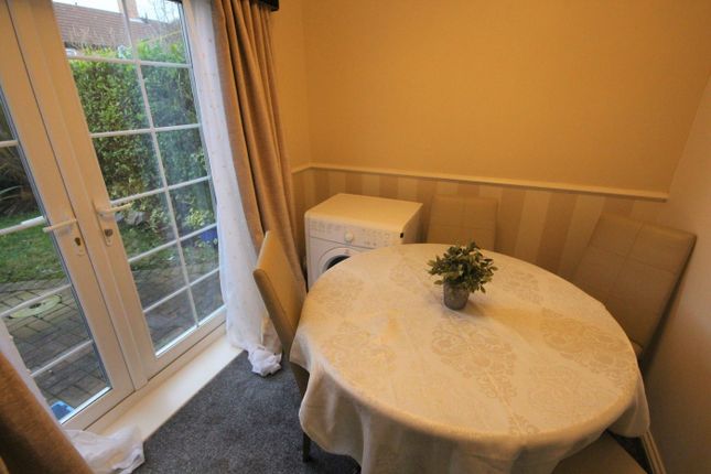 A Cozy Kitchenette Featuring A Dining Area, Perfec...