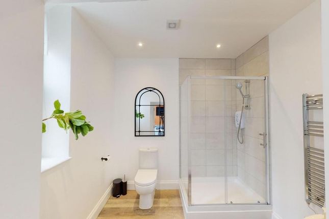 A Bright And Modern Bathroom Featuring A Spacious ...