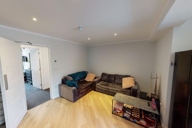 A Bright And Inviting Living Room, Perfect For Soc...