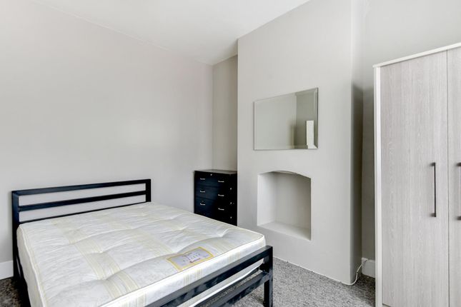 A Spacious And Clean Master Bedroom Featuring A Do...