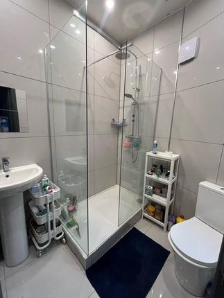 Modern Bathroom With Large Corner Glass Shower Enc...