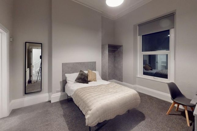 A Cozy And Inviting Double Bedroom Featuring Moder...