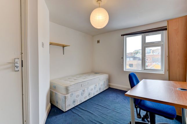 A Tidy And Well-Lit Student Bedroom Featuring A Co...