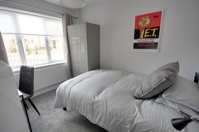 A Bright And Inviting Double Bedroom Featuring A c...