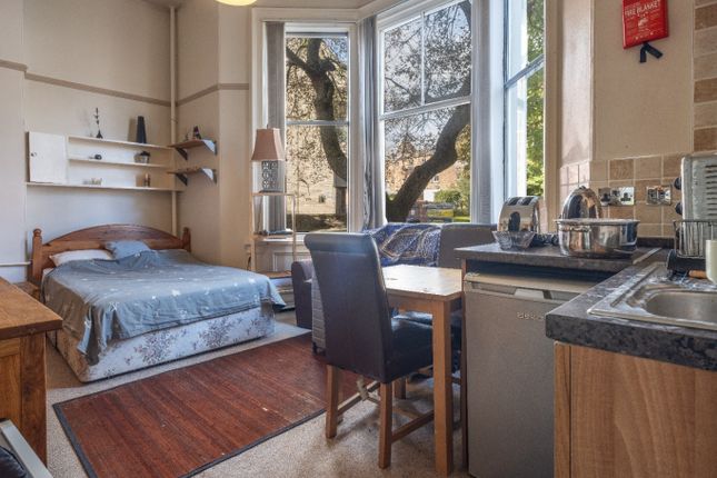 Bright And Cozy Living Space Featuring A Large Bay...