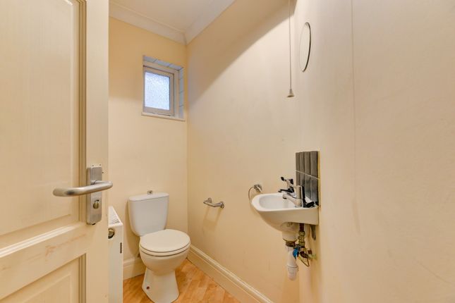 A Clean And Well-Maintained Bathroom With A Toilet...