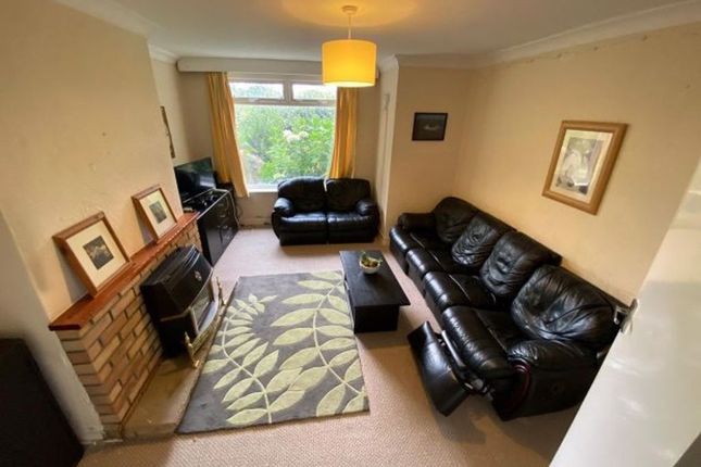 A Spacious And Inviting Living Room With A Large B...