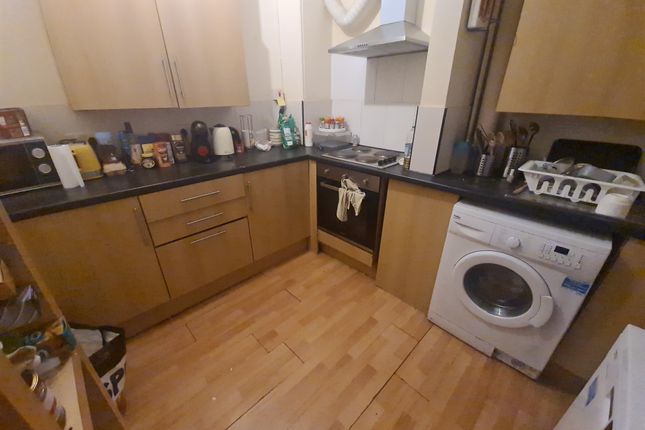 Bright And Functional Kitchen Featuring Modern Woo...