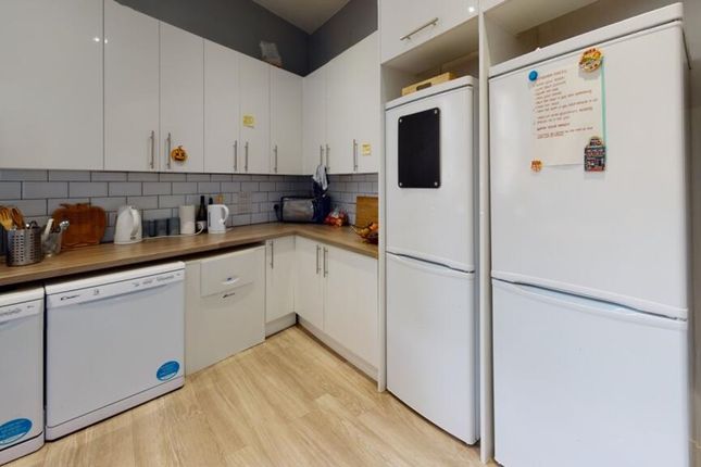 Modern Kitchen Featuring Ample Cabinetry, Sleek Co...