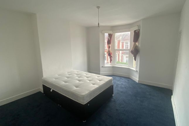 A Bright Double Bedroom Featuring A Large Bay Wind...