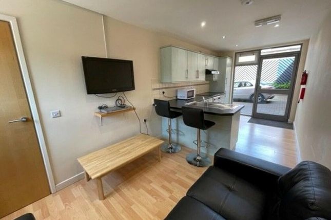 Bright And Modern Living Room With A Sleek Black S...