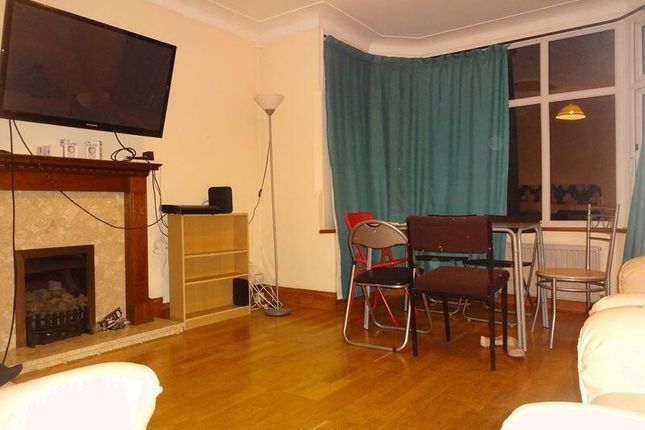 A Cozy Living Room Featuring A Fireplace, Large Wi...