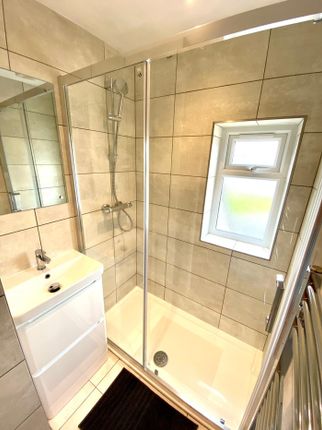 A Modern And Clean Bathroom Featuring A Stylish Sh...