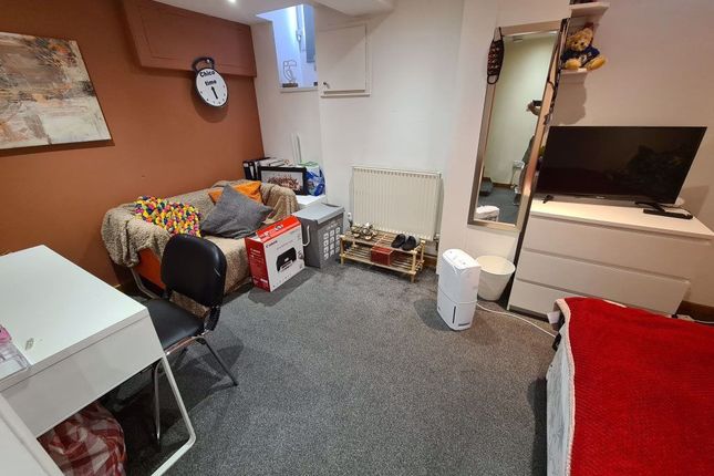 A Neat And Functional Small Room Featuring A Compa...