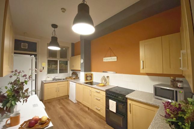 Warm, Modern Kitchen With Wooden Cabinets, Integra...