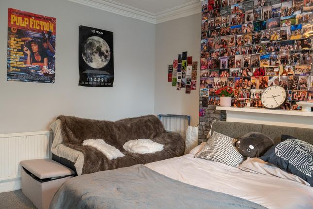 A Cozy And Well-Maintained Living Room Featuring A...