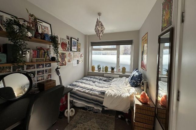 This Cozy Double Bedroom Features A Comfortable Be...
