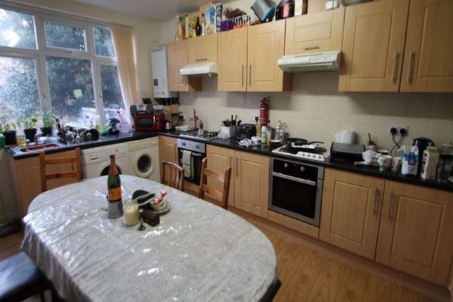 A Bright And Functional Kitchen Featuring Ample Wo...