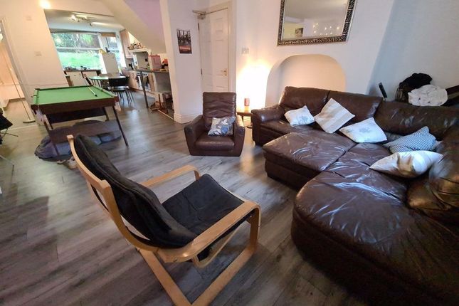 A Spacious And Inviting Living Room Featuring Comf...