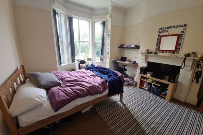 A Cozy Double Bedroom Featuring A Comfortable Doub...