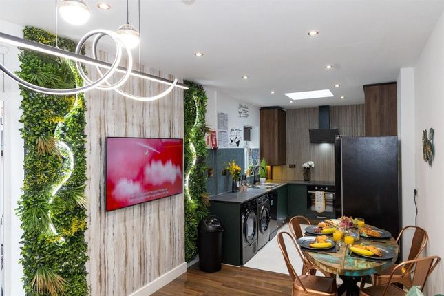 A Modern, Stylish Kitchen Featuring Sleek Black Ap...