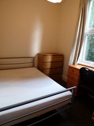 Bright And Inviting Double Bedroom Featuring A Com...