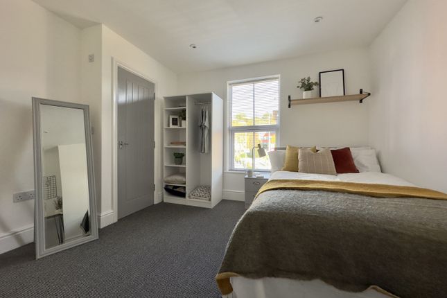 A Bright And Inviting Double Bedroom With A Stylis...