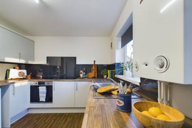 A Modern And Tidy Kitchenette With Ample Storage A...