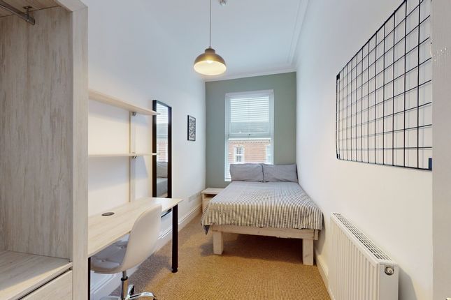 A Bright And Tidy Double Bedroom Featuring A Comfo...