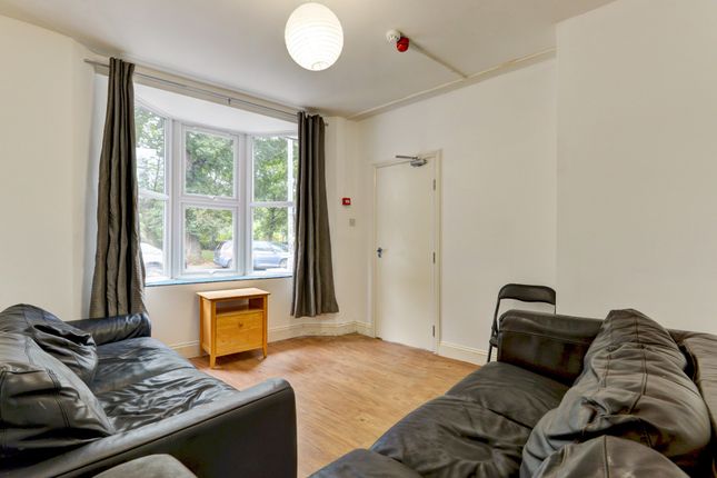 Bright And Inviting Living Room Featuring Ample Na...