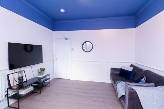 A Spacious And Inviting Modern Living Room With Br...