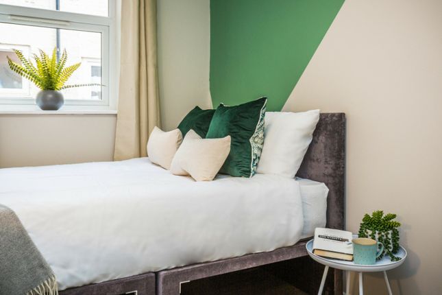 A Bright And Inviting Double Bedroom Featuring Sty...