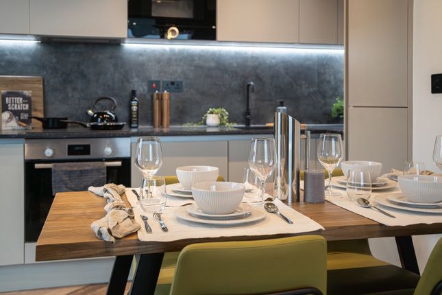 A Modern And Stylish Kitchenette With Sleek Applia...