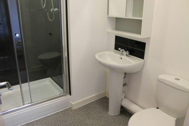 A Modern Bathroom Featuring A Spacious Shower, Sle...