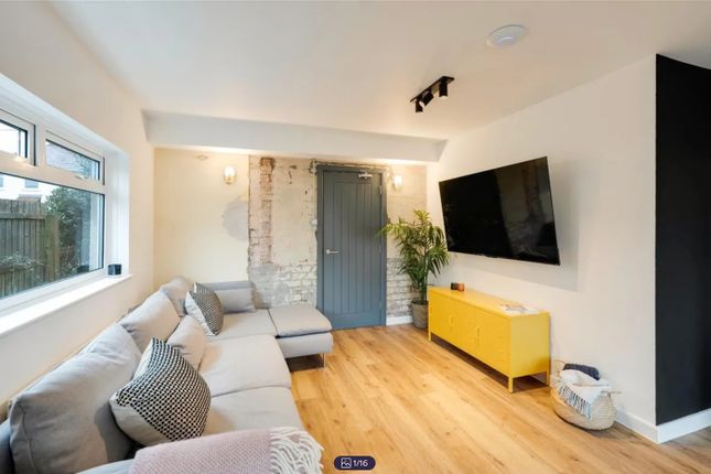 A Spacious And Inviting Modern Living Room With Am...