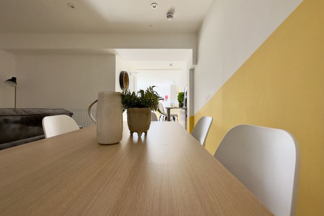 A Bright And Inviting Living Room With Modern Deco...