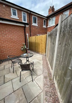 A Neat And Private Garden Area Featuring A Stone-P...