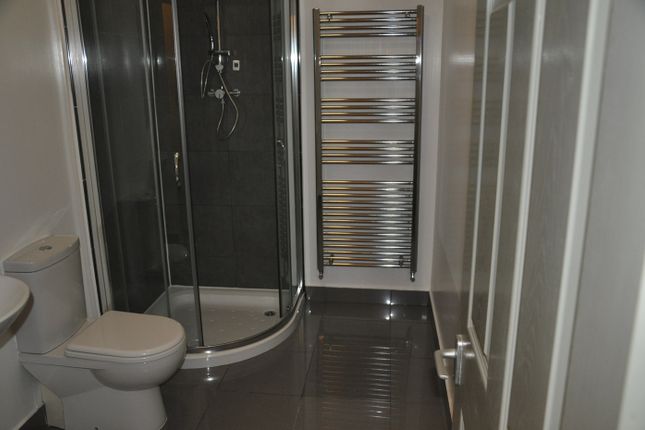 A Modern And Clean Bathroom Featuring A Sleek Show...