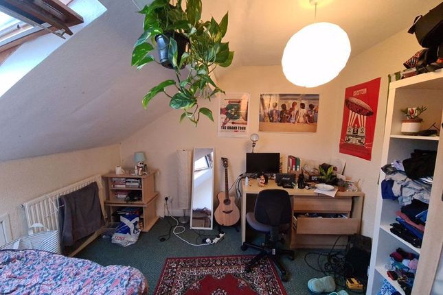 A Cozy Bedroom With Natural Light Streaming In, Fe...