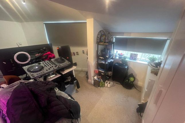 A Cozy Room With A Dj Setup, Offering A Creative S...
