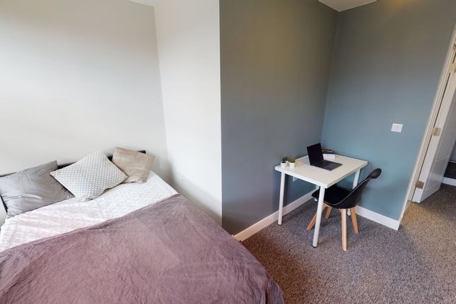 A Cozy And Inviting Double Bedroom Featuring A Com...