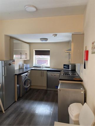 Bright And Functional Kitchen With Modern Applianc...